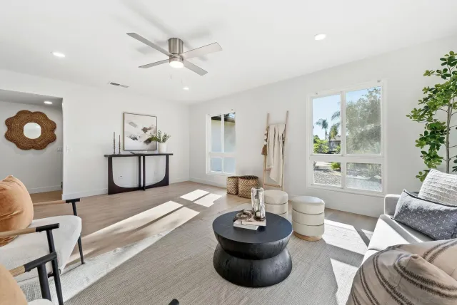 a living room with furniture and a large window