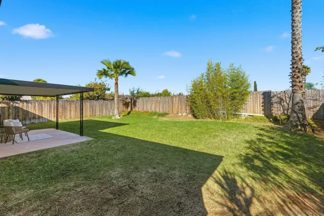 a view of a garden with a house