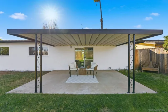 a patio with table and chairs