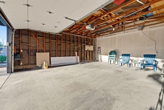 a view of the room with wooden floor