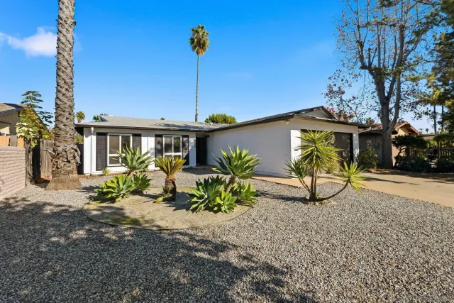 a house view with a garden space