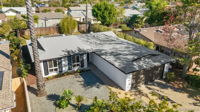 an aerial view of a house with swimming pool
