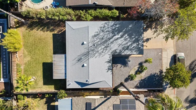 an aerial view of a house with a garden