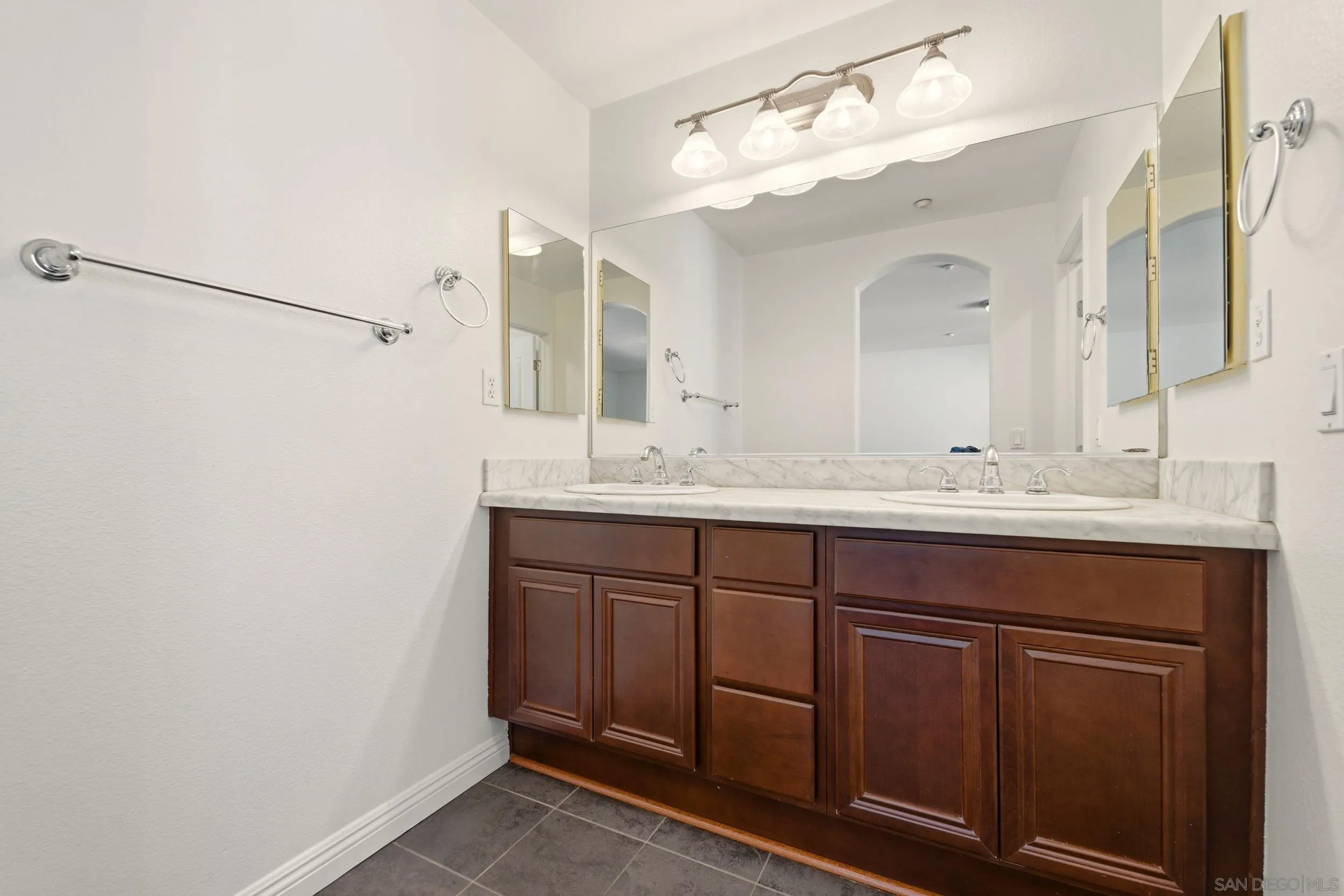 16953 New Rochelle Way, Unit 62 San Diego, CA 92127 - Photo 15 of 21 a bathroom with a sink and a mirror