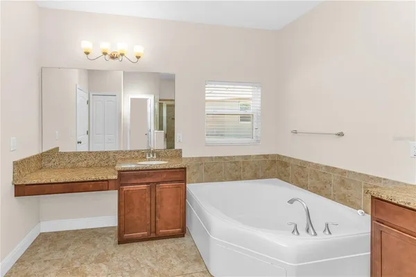 a bathroom with a bathtub and a sink