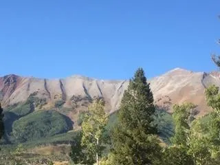 a view of mountains and sunset