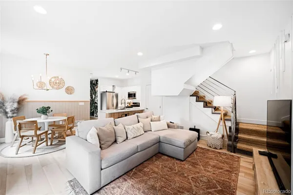 a living room with furniture and a table