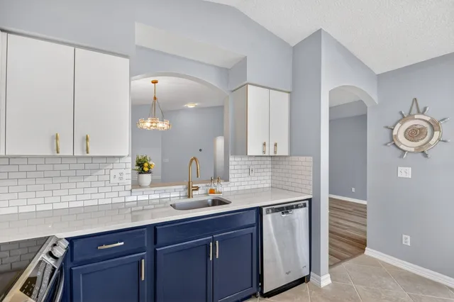 a view of an empty room and wooden floor