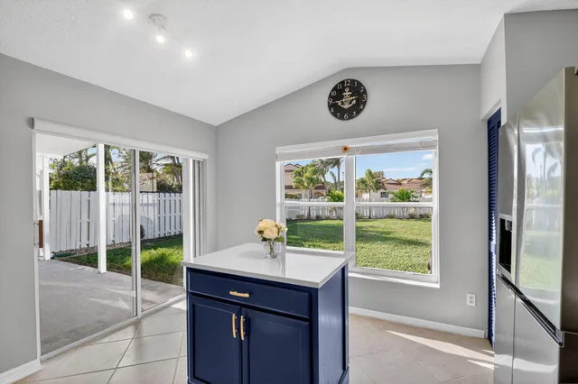 a bathroom with a sink vanity mirror and toilet