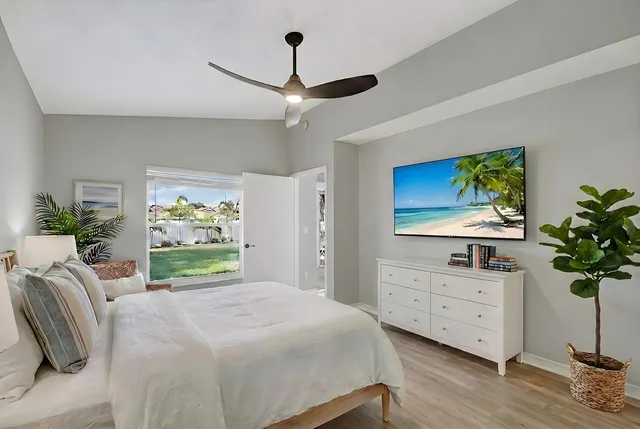 an aerial view of a house with a garden and swimming pool