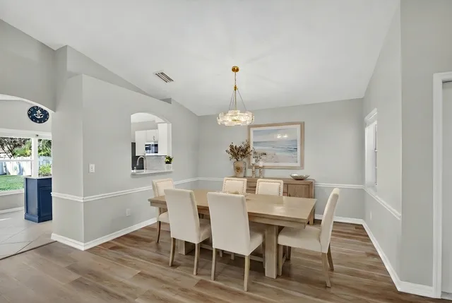 a bedroom with a bed and a potted plant