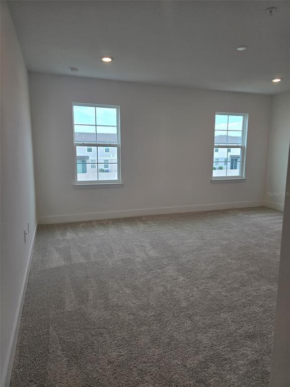 2445 Magnolia Reserve Road Ocoee, FL 34761 - Photo 14 of 19 an empty room with a window