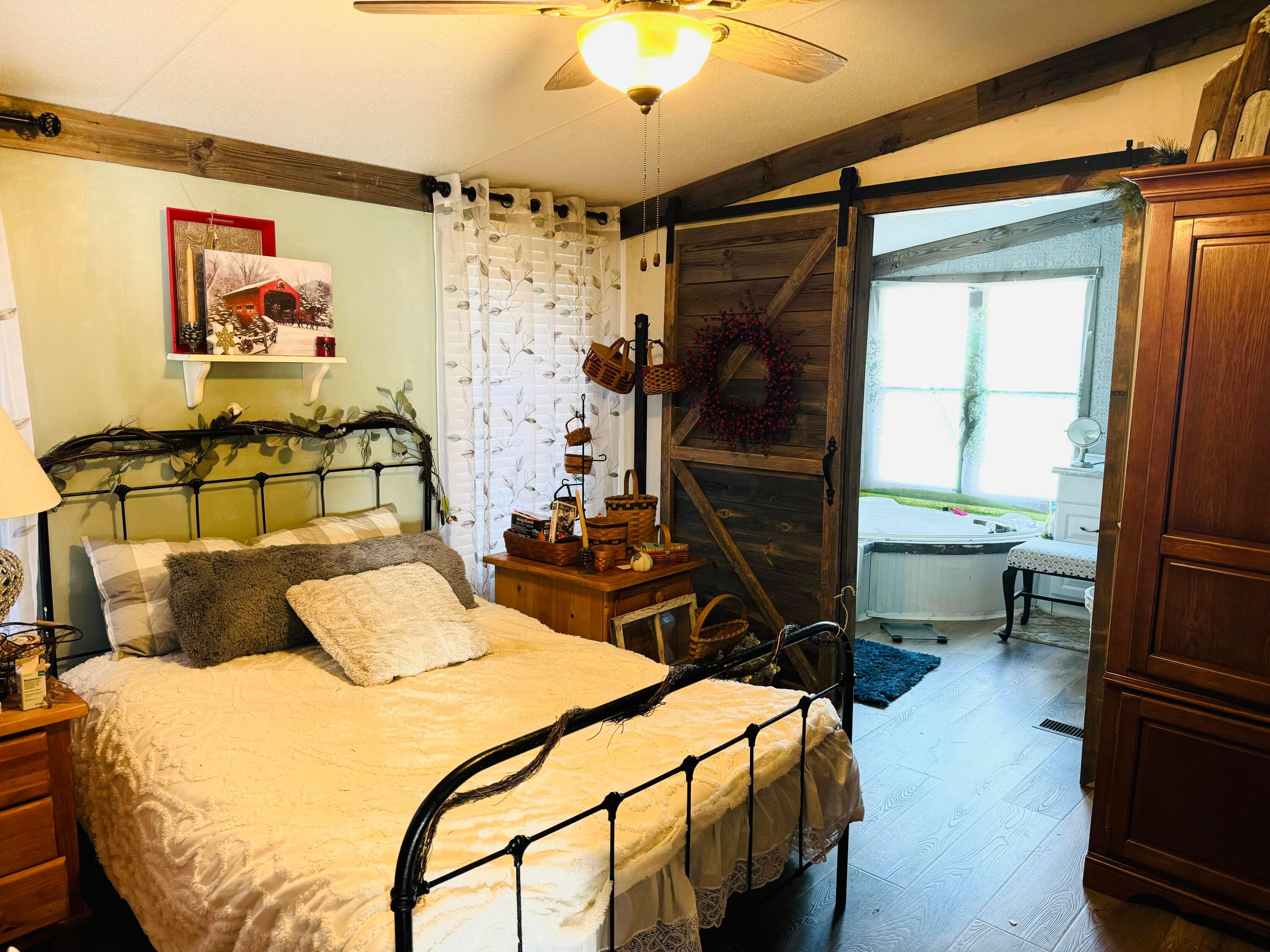 709 South Broadway Street Racine, OH 45771 - Photo 11 of 27 Bedroom with large bathroom