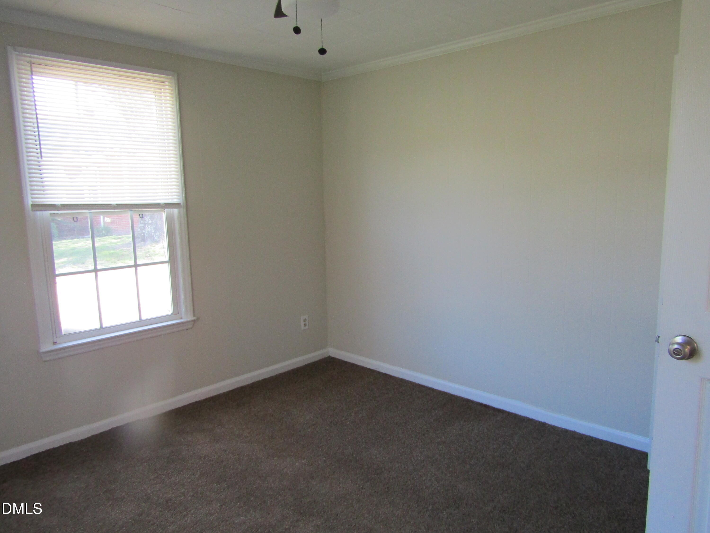 1719 Lower Hopedale Road Burlington, NC 27217 - Photo 4 of 12 an empty room with a window