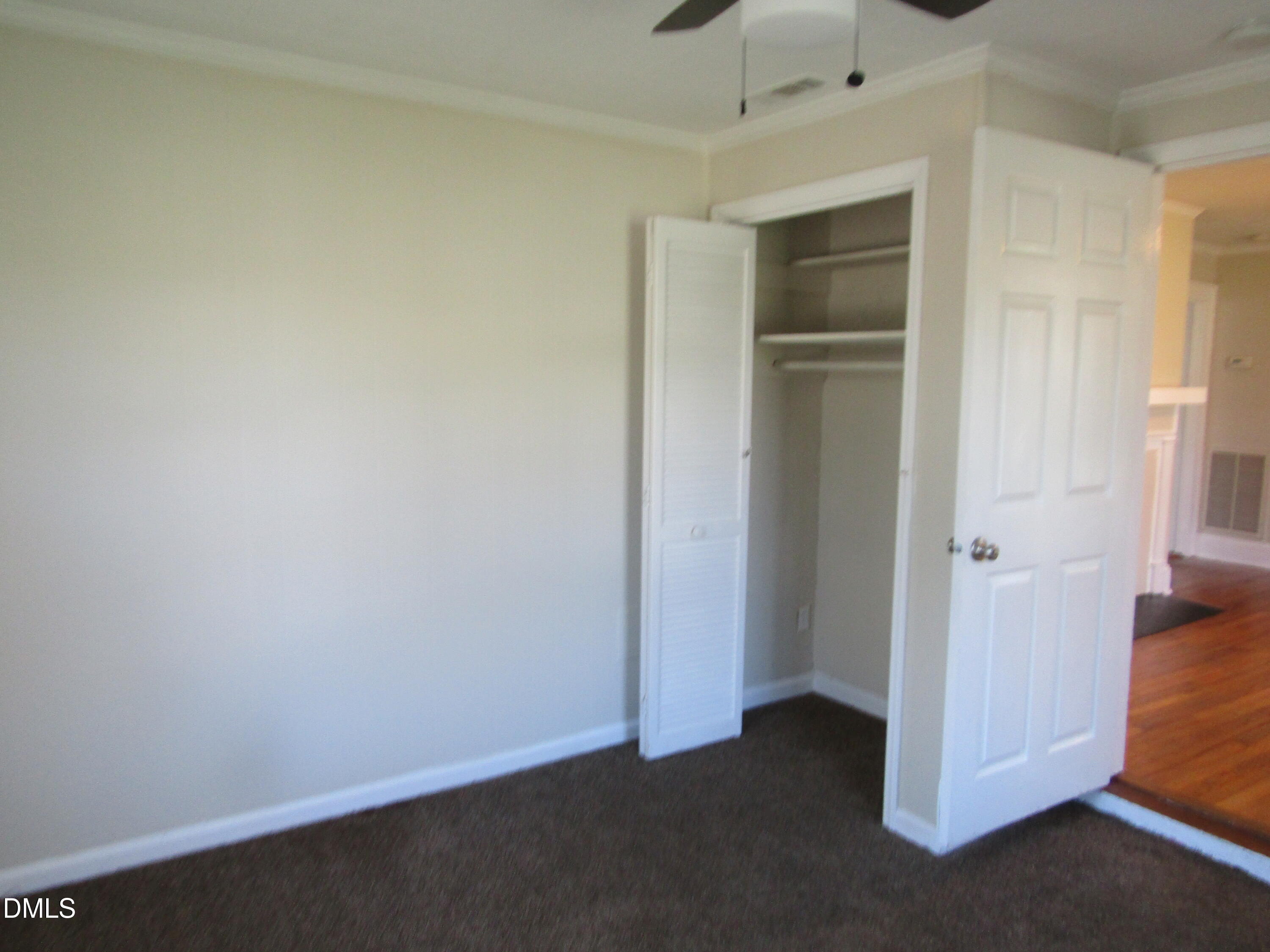 1719 Lower Hopedale Road Burlington, NC 27217 - Photo 5 of 12 an empty room and closet area