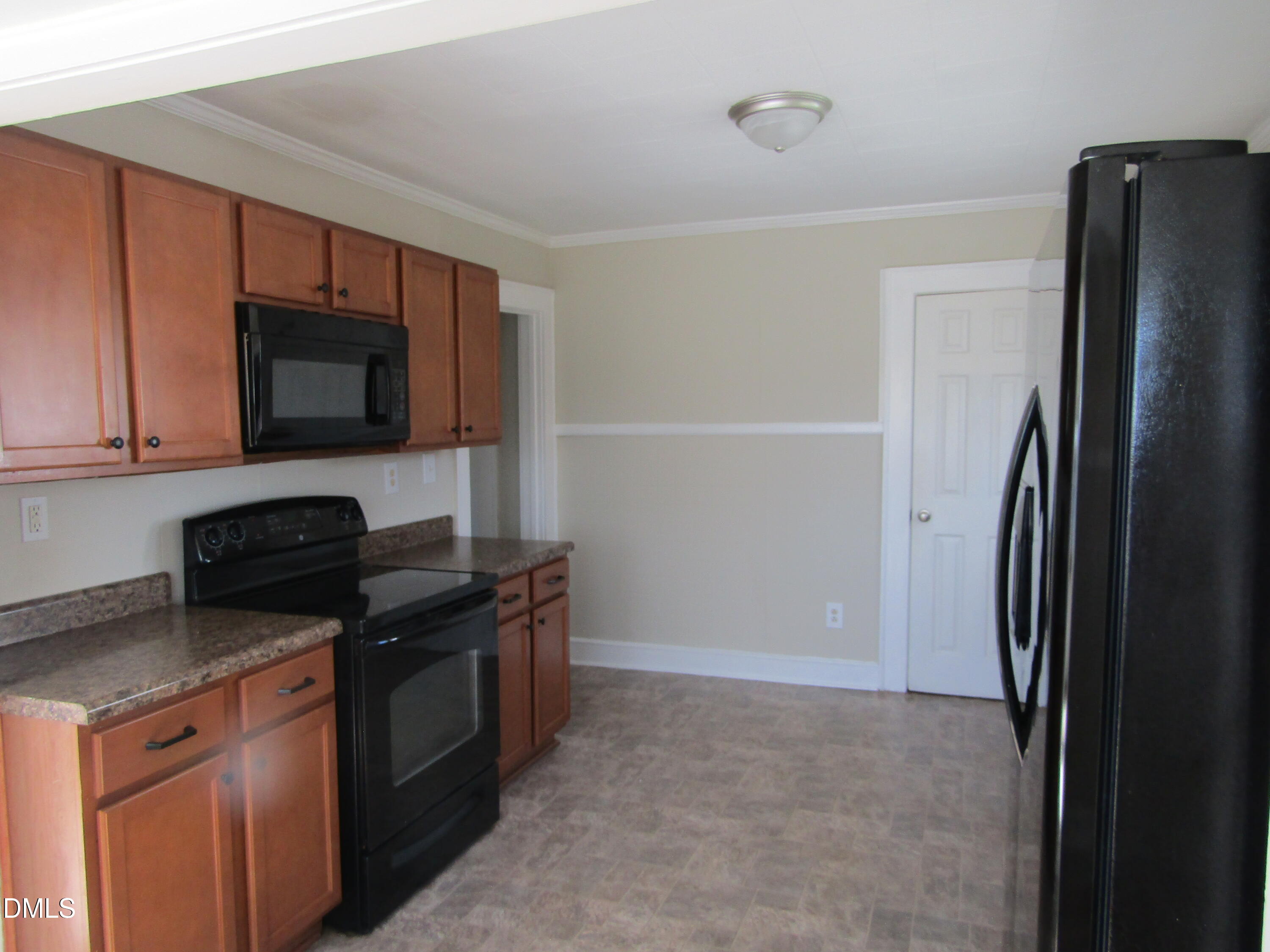 1719 Lower Hopedale Road Burlington, NC 27217 - Photo 10 of 12 a kitchen with a refrigerator stove and microwave