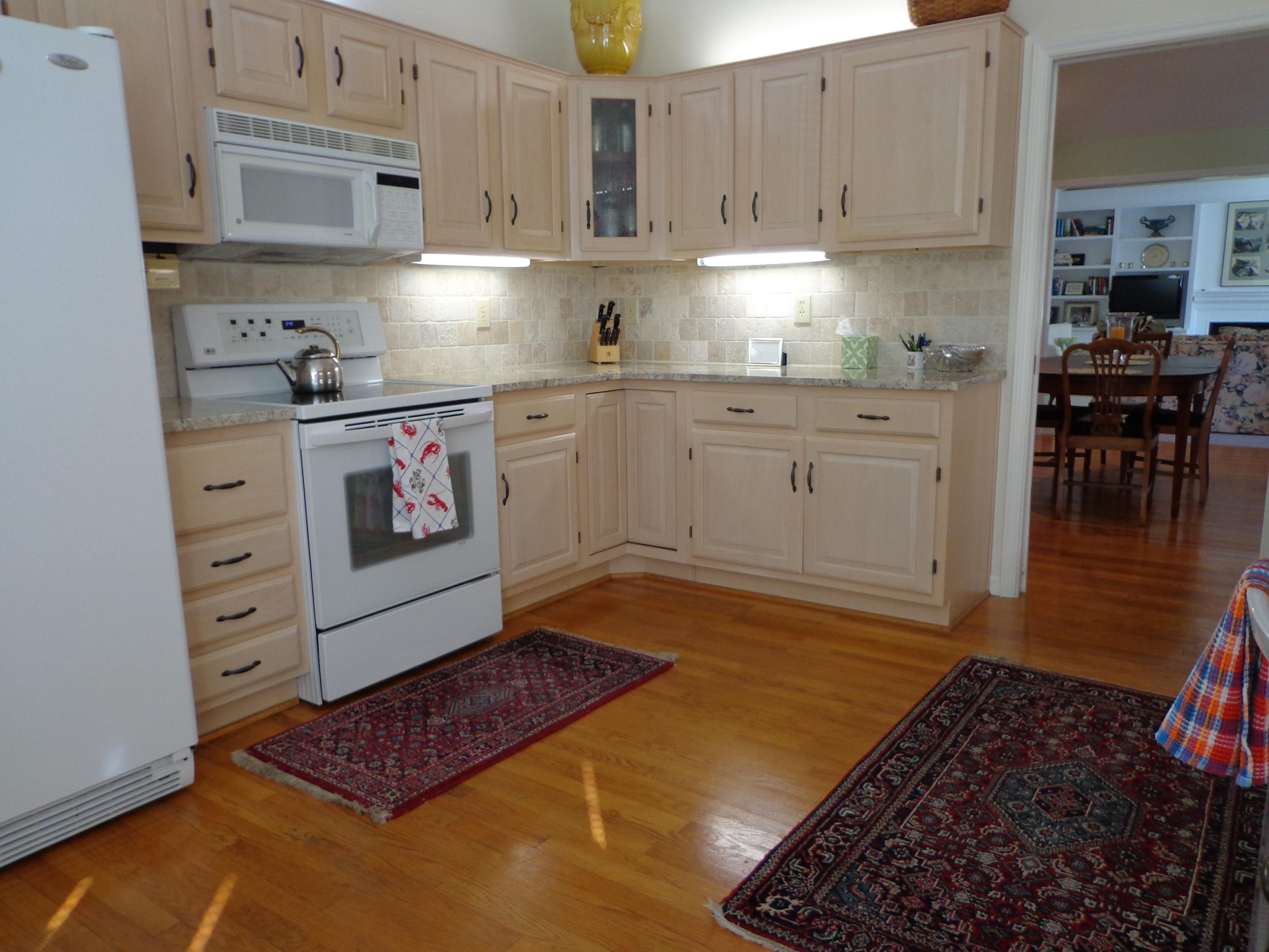 1908 McVitty Road Salem, VA 24153 - Photo 16 of 44 a kitchen with cabinets and wooden floor