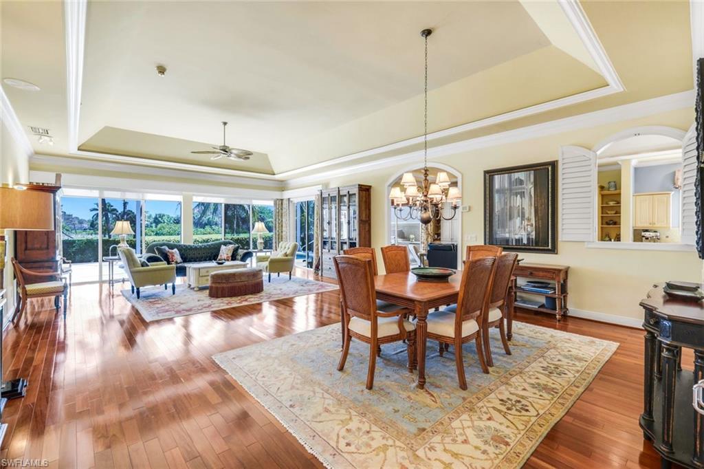 15588 Whitney Lane Naples, FL 34110 - Photo 12 of 47 a view of a dining room with furniture window and wooden floor