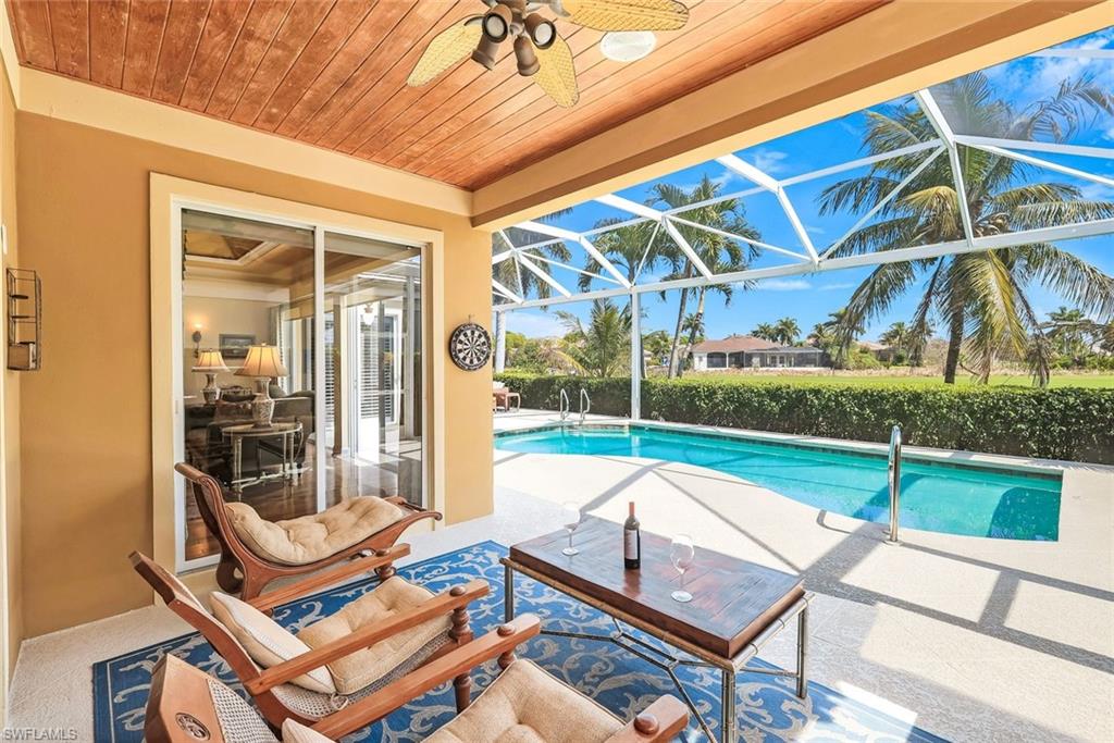 15588 Whitney Lane Naples, FL 34110 - Photo 28 of 47 a view of a patio with a backyard