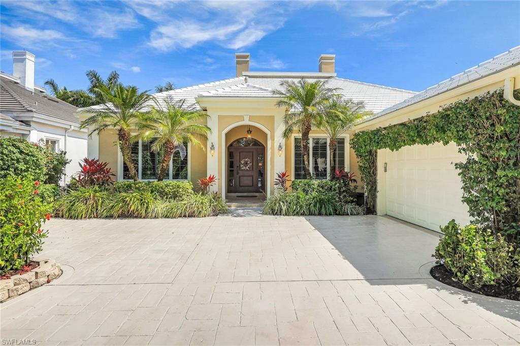 15588 Whitney Lane Naples, FL 34110 - Photo 32 of 47 a view of a house with potted plants