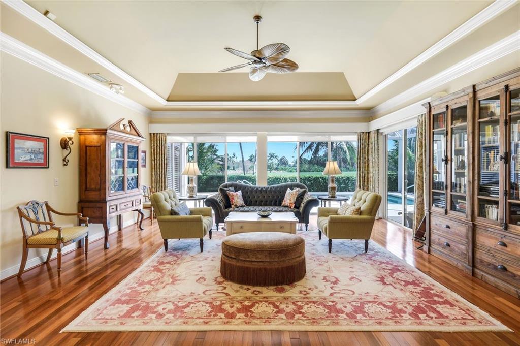 15588 Whitney Lane Naples, FL 34110 - Photo 8 of 47 a living room with furniture and a large window