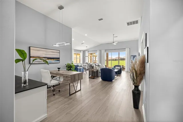 a view of a livingroom with furniture window and wooden floor