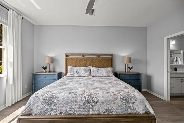 a bedroom with a bed and a lamp