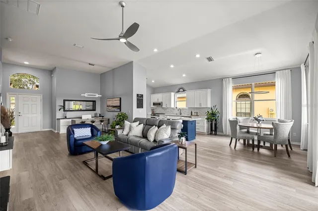 a dining room with furniture window and wooden floor