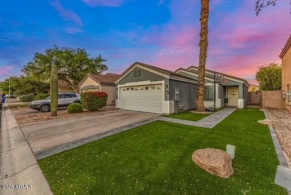 a front view of a house with a yard