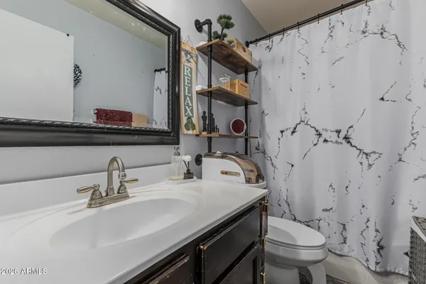 a bathroom with a sink and a toilet