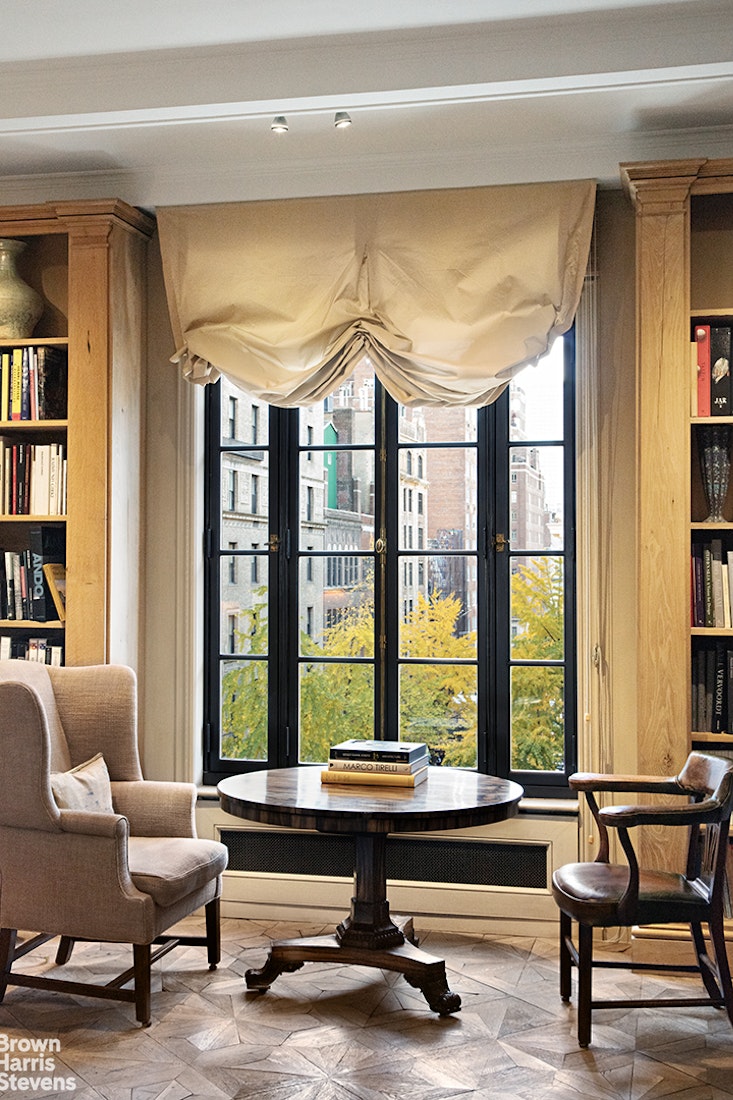 563 Park Avenue, Unit 5/6W Manhattan, NY 10065 - Photo 2 of 13 a living room with furniture and a large window