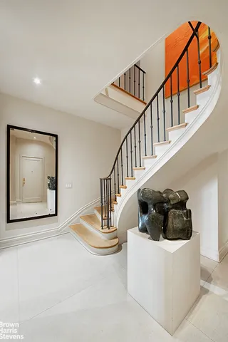 a kitchen with a stove a sink and cabinets