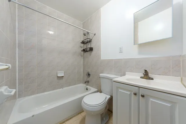a kitchen with cabinets stainless steel appliances and counter space