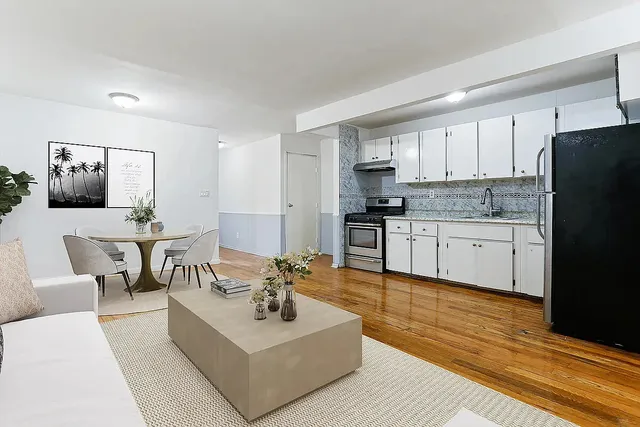 a view of a building with sitting area