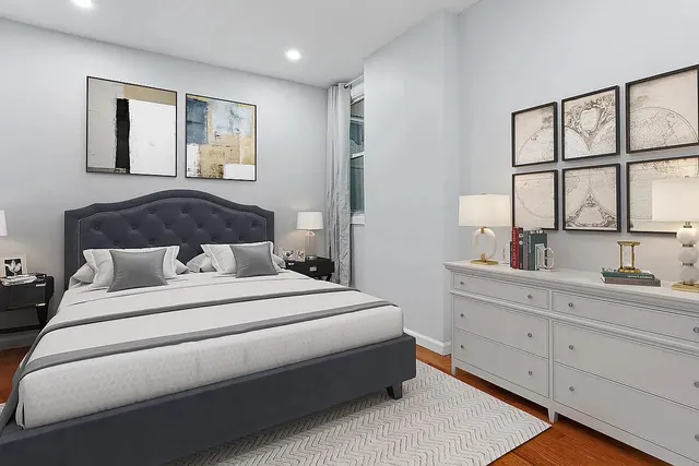 a living room with stainless steel appliances kitchen island granite countertop furniture and a couch