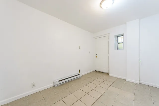 a picture of a bench in front of a window