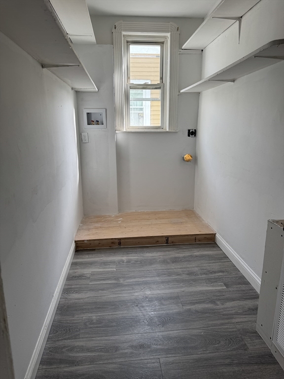 419 Seaver Street, Unit 3 Boston, MA 02121 - Photo 21 of 22 a view of an empty room with wooden floor and a window