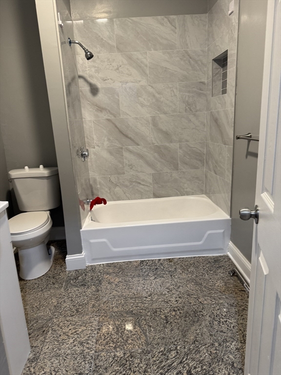 419 Seaver Street, Unit 3 Boston, MA 02121 - Photo 22 of 22 a bathroom with a bathtub and toilet