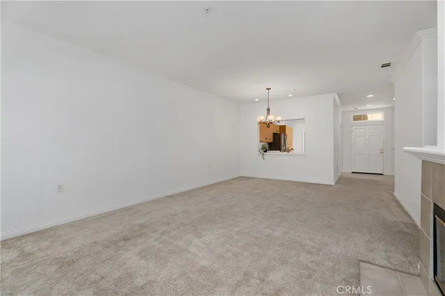 an empty room with a empty space and windows