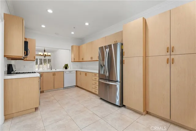 a kitchen with a refrigerator sink and microwave