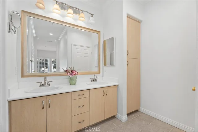 a bathroom with a shower sink and mirror