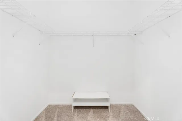 a view of a porch with furniture and a backyard