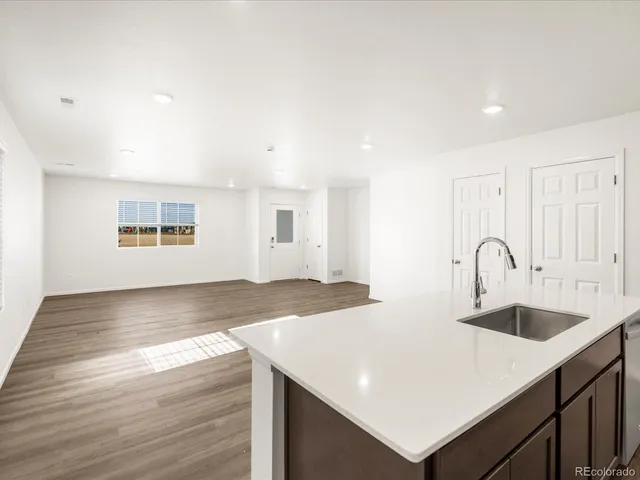 a view of a kitchen counter space and a sink