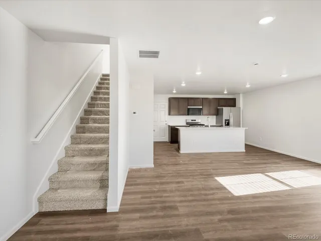 a view of kitchen with sink and wooden floor