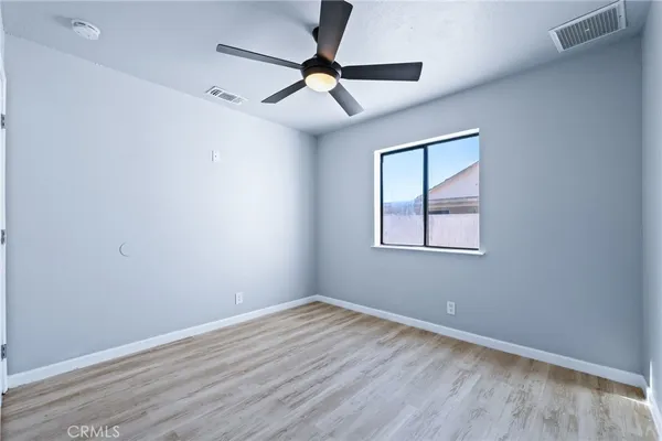 a view of a hallway with a window