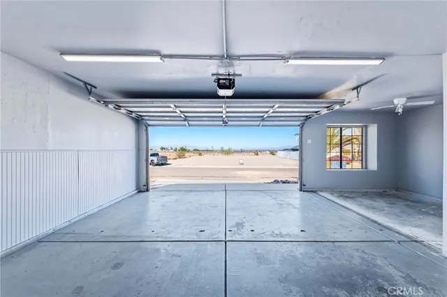 a view of a white house with a yard