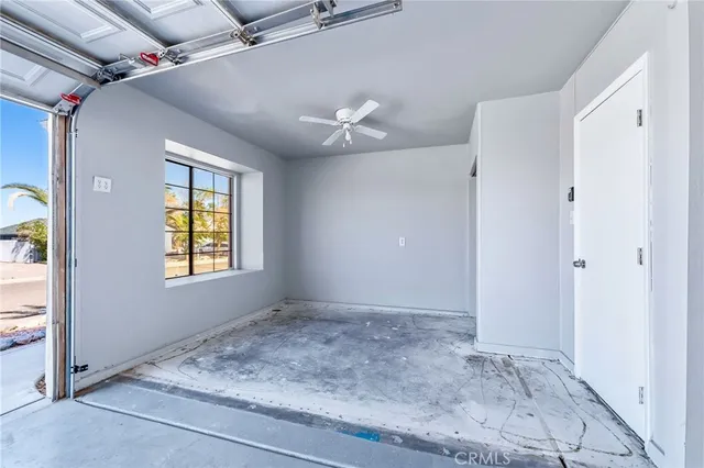 an aerial view of a house with outdoor seating