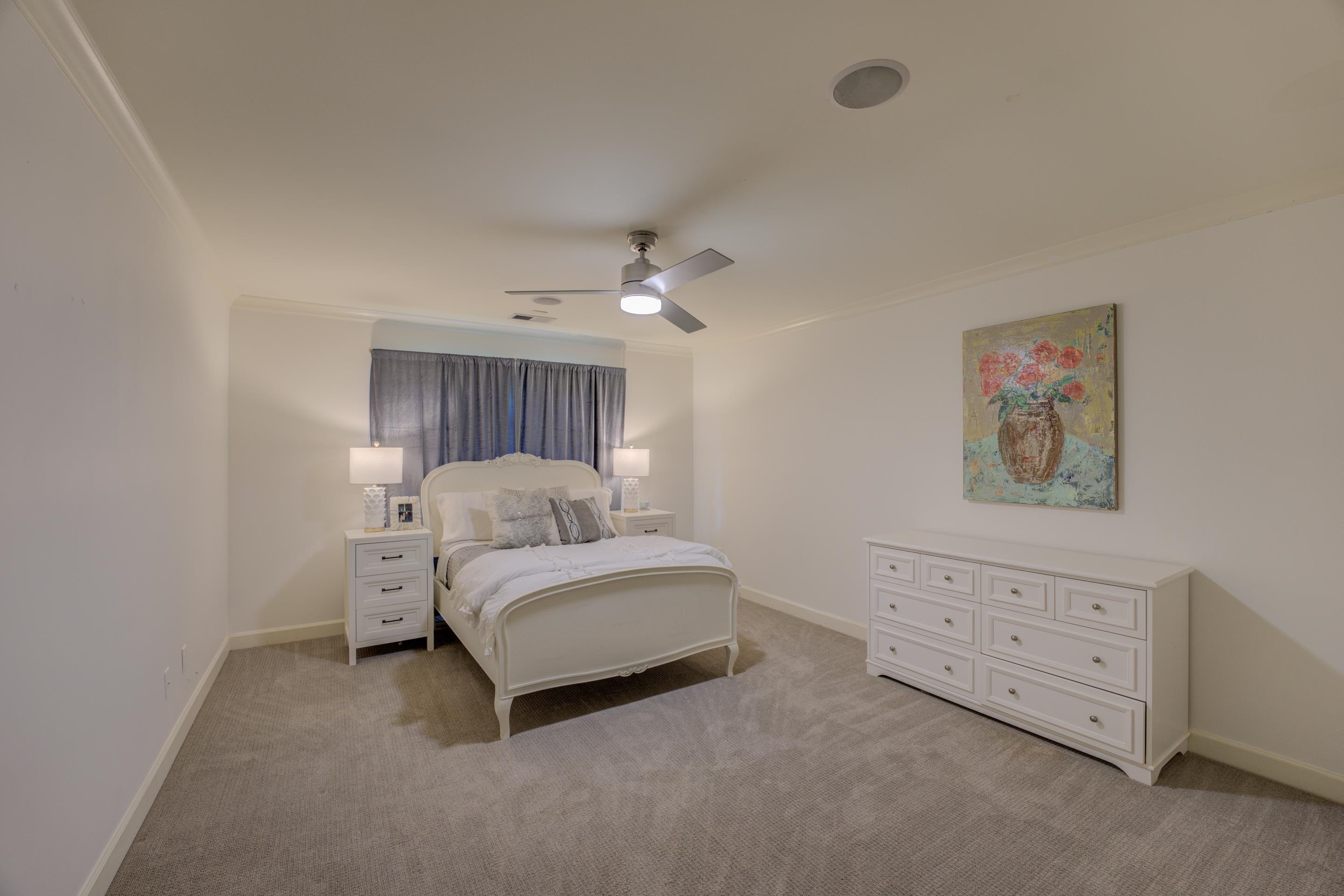 5074 Shady Grove Road Memphis, TN 38117 - Photo 14 of 25 Step into a haven of tranquility and comfort within the enchanting embrace of this bedroom. Every detail has been carefully curated to create an atmosphere that is both inviting and soothing, ensuring a peaceful retreat from the outside world.