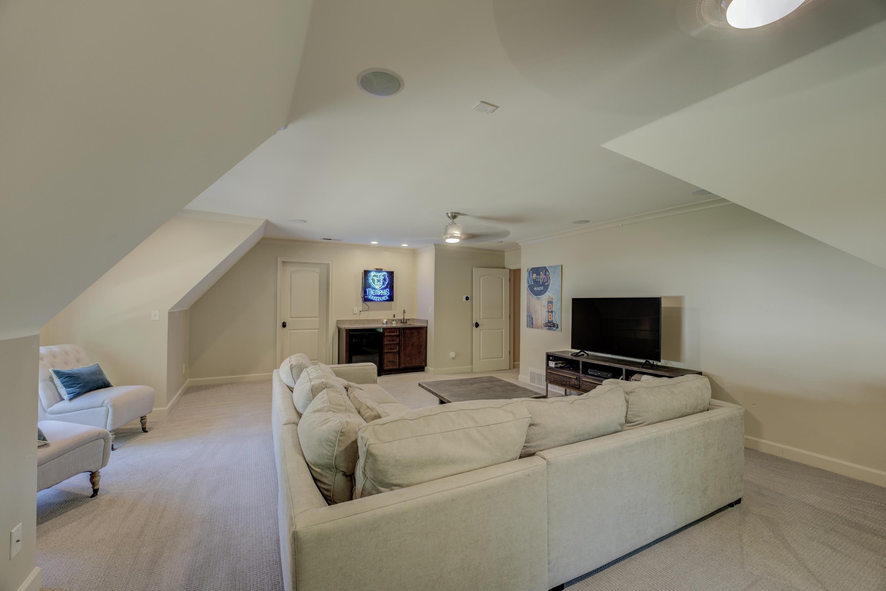 5074 Shady Grove Road Memphis, TN 38117 - Photo 19 of 25 Upstairs, a sprawling bonus room awaits, ready to be transformed into a media room, home office, or whatever your heart desires.