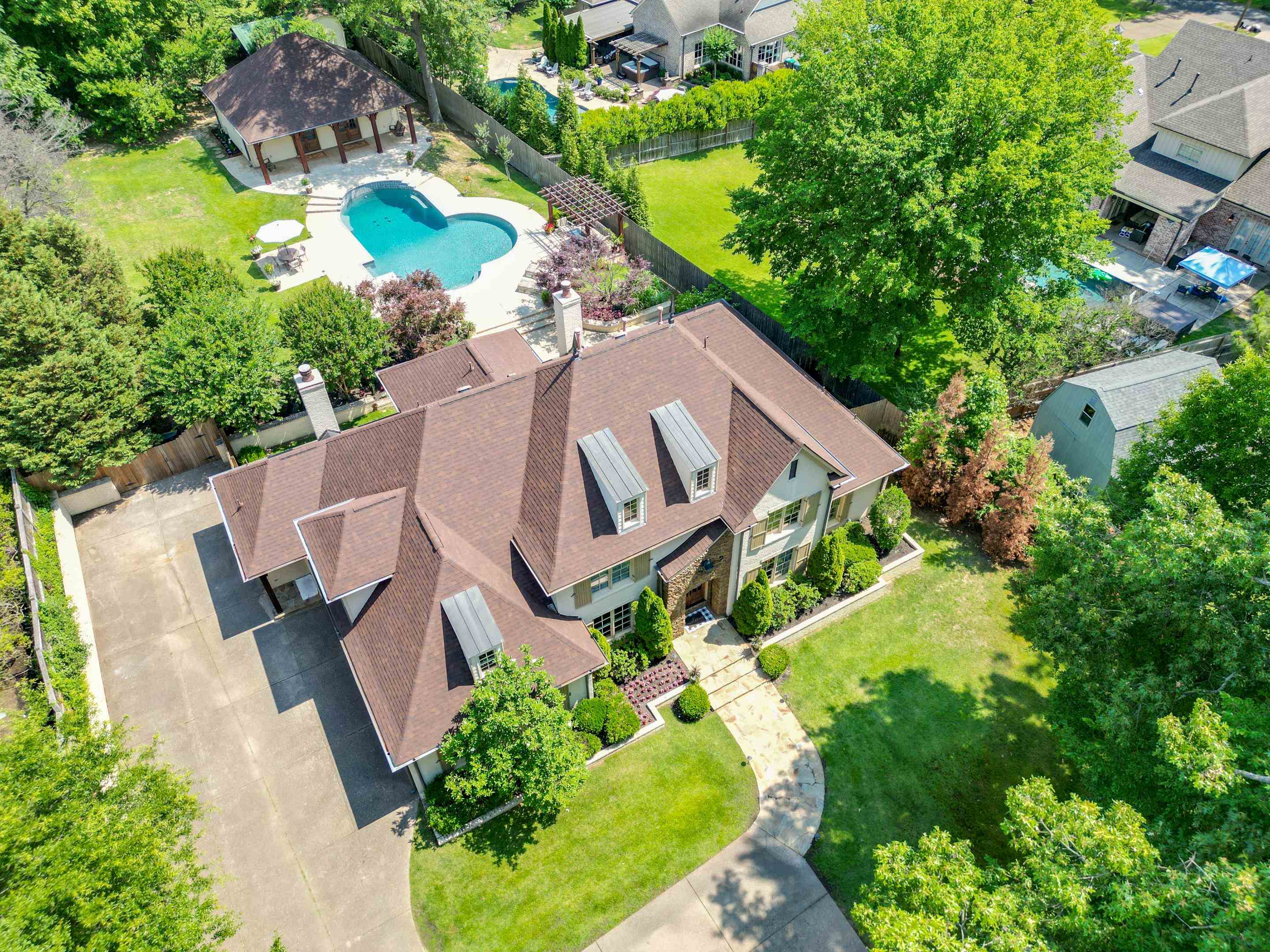 New hardwood floors grace the downstairs. The entire house is wired with speakers, ensuring that music and entertainment flow effortlessly. Smooth ceilings, WiFi Ethernet on every outlet, new roof and a 3 car garage are just a few perks.